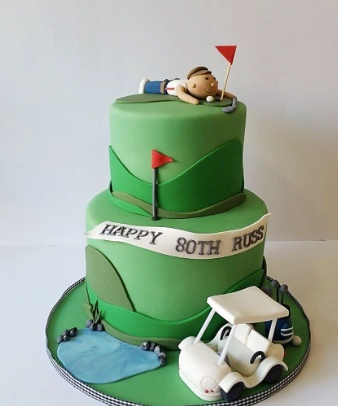 A golf cake topper with a golf fan and birthday party design