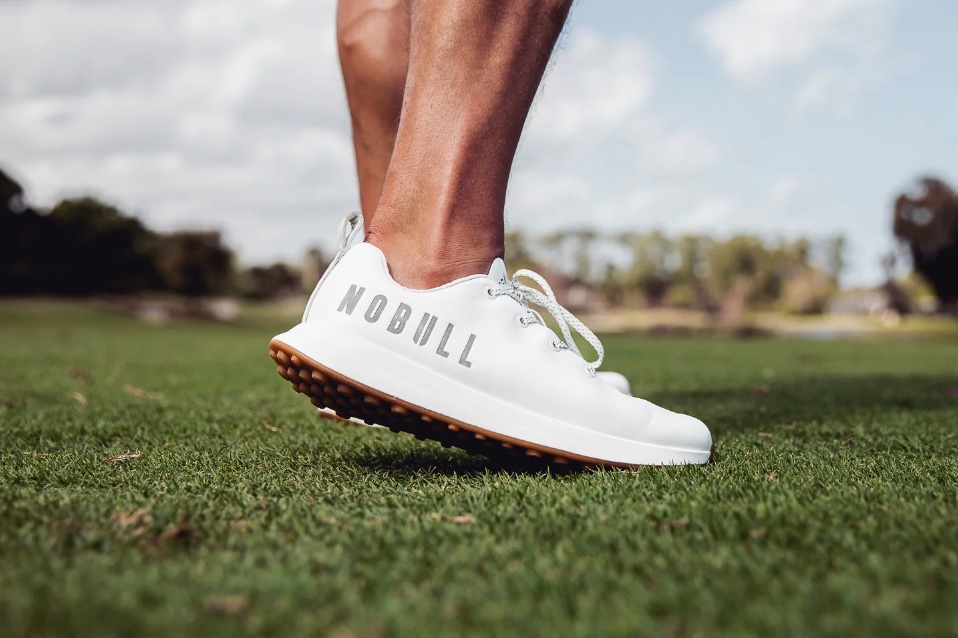 A pair of breathable golf shoes with ventilation
