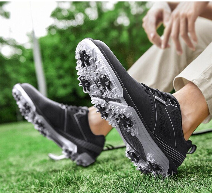 A pair of waterproof golf shoes with water-resistant features