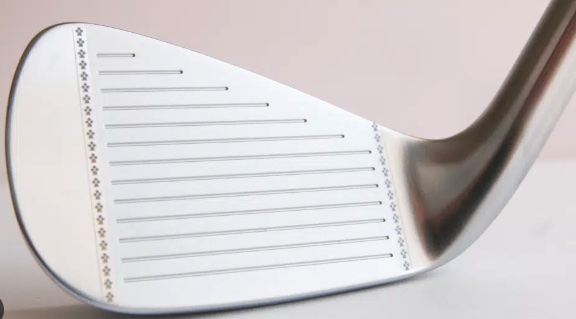 A golf club with clean grooves for creating backspin